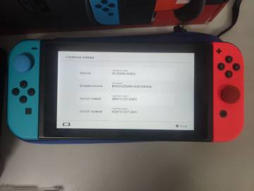 01-200181725: Nintendo switch with neon blue and neon red